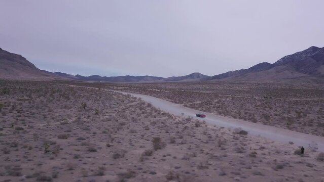 Drone footage following Dodge Challenger near Red Rock Canyon, United State