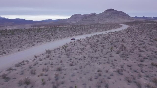 Drone footage following Dodge Challenger near Red Rock Canyon, United State
