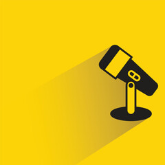 microphone icon with shadow on yellow background