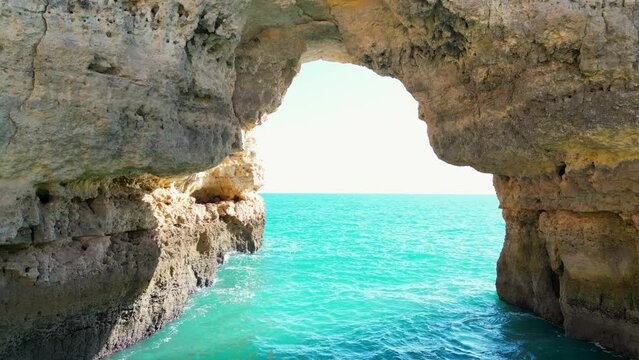 The Albandeira arch in the coast of Algarve, Portugal. Seven Hanging Valleys filmed with 4K drone