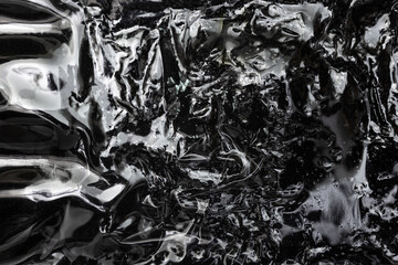 Close-Up of Transparent Plastic Film Wrap With Textured Overlays and Shadows. 