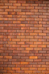 Fototapeta premium Red Textured Brick Wall Background with Old Cement Blocks and Brown Stone Pattern in Exterior Construction Architecture