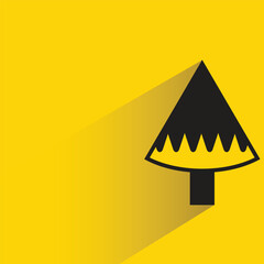 Christmas tree icon with shadow on yellow background