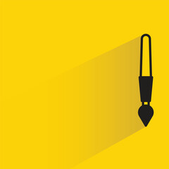 paint brush icon with shadow on yellow background