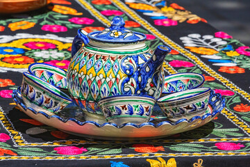 Tea set. Teapot and cups. Traditional ceramics, typical handicraft souvenir in Bukhara (Buxoro)...
