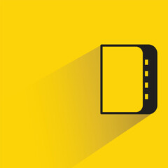 book icon with shadow on yellow background