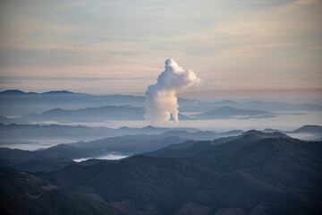 Beautiful morning scenery with fog in the background at Mae Moh Lignite Coal Power Plant, Lampang,...