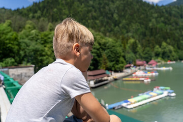 Reflections of Innocence: A Young Dreamer Gazing Into the Azure Abyss