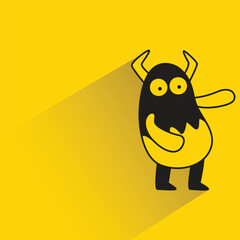 cartoon monster character with shadow on yellow background