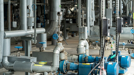 Pipes and valves in large industrial facilities, petrochemical plant.