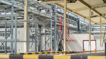 A shop with many pipes and tanks, a complex system of infrastructure and functionality, a refinery.