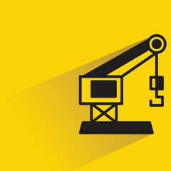 crane equipment icon with shadow on yellow background