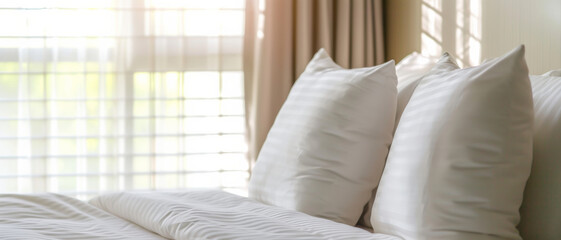 Pristine hotel bed, a haven of rest and luxury with sunlit sheer curtains