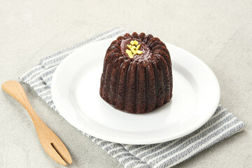 Chocolate cake topped with cream cheese and melted chocolate
