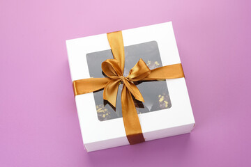 Chocolate cake in box. Gifts festive food love concept.
