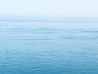 Calm blue sea water surface at morning. 