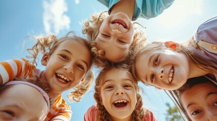 A group of delighted and adorable young children playing together, experiencing joy and fun. A collective portrait captures the happiness of kids huddled together, looking down at the camera - obrazy, fototapety, plakaty