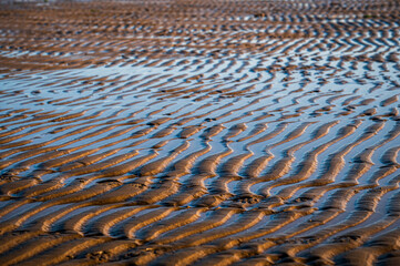 The beach of Lignano Sabbiadoro and its historic lighthouses.