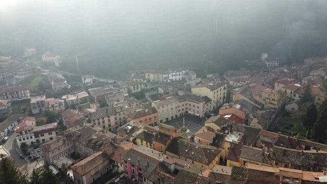 4K footage of a  small town in the center of Italy during a foggy day