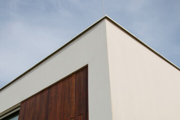 Minimalist architecture detail, modern facade wood wall siding low angle view