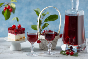 Cherry liqueur in a carafe and glasses