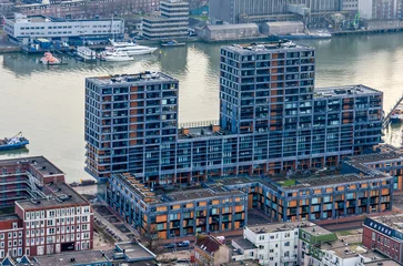 Fotobehang Rotterdam, The Netherlands, January 29, 2023: high angle view of a large scale residential block overlooking Maashaven harbour © Frans
