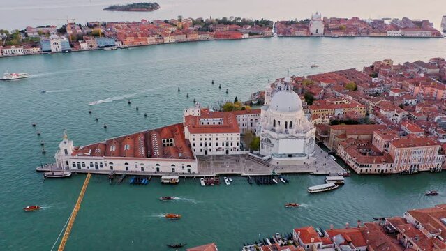 Crane shot, aerial view of Punta della Dogana and Salute church with Grand Canal, Venice, Italy