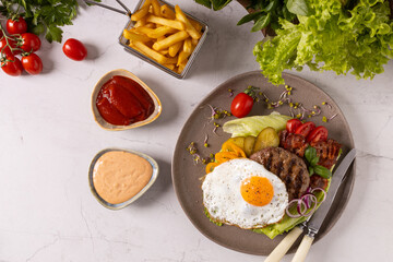 Beef burger without a bun with a fried egg
