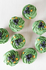 delicious cupcakes with cream and berry filling - 725417782