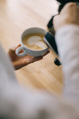 Close-up, barista preparing latte.