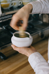 Close-up, barista prepares matcha. The work process of a barista in a cafe.