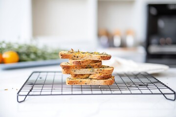 gluten-free bread stacked on a cooling rack