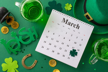 Top-view shot of festive calendar, leprechaun hat, beer mugs, lucky horseshoe, and pot brimming with gold coins. Trefoils, confetti and party glasses adorn vibrant green backdrop