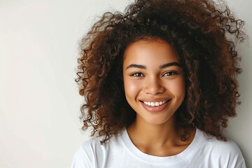 a woman with curly hair smiling