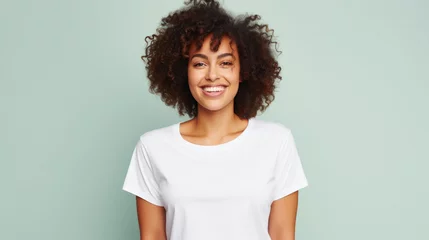 Poster Young happy smiling African American woman model wearing tshirt standing on color background. Face skin hair care cosmetics makeup, fashion ads. Beauty portrait. White t-shirt mock up template . © Synthetica