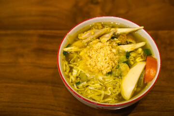 Soto ayam is a typical Indonesian food in the form of a type of chicken soup with a yellowish sauce