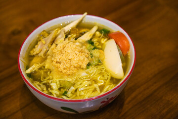 Soto ayam is a typical Indonesian food in the form of a type of chicken soup with a yellowish sauce
