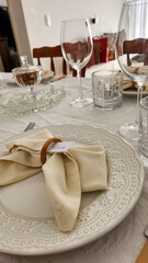 dining table decorated with plates and glasses