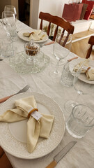 dining table decorated with plates and glasses