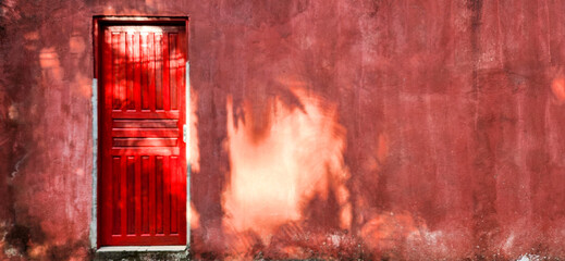 old house with red door and rustic wall