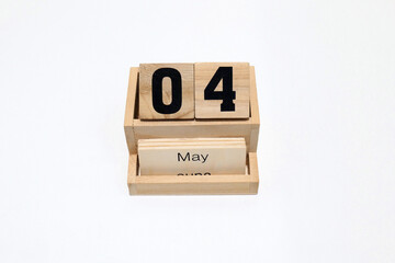 4th of May wooden perpetual calendar. Shot close up isolated on a white background