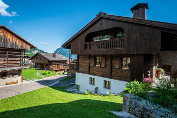 Fototapeta na wymiar Sauris, pearl of Carnia. Ancient village with wooden and stone houses.