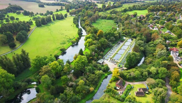 Aerial shot of sewage farm next to Chalk stream in Hampshire, UK