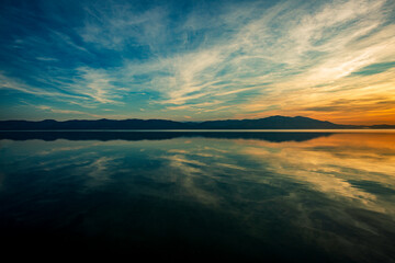 sunset on a calm lake no wind clear sky - obrazy, fototapety, plakaty