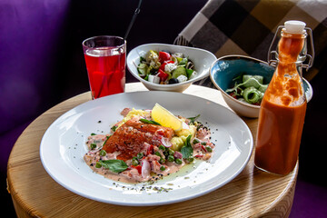 fried salmon with mashed potatoes and vegetables is on a plate