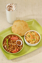 Punjabi Chana Masala With Veg Pulao and Puri, Lassi
