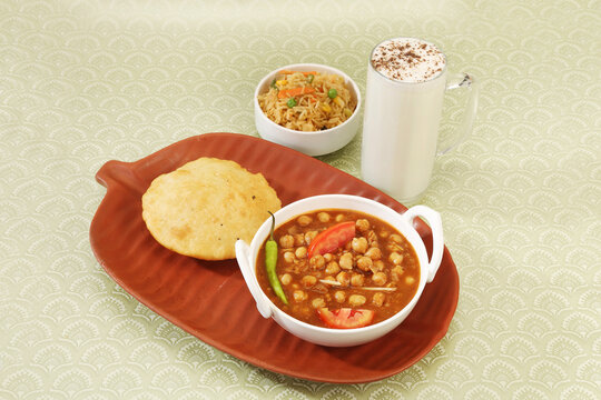 Punjabi Chana Masala With Veg Pulao and Puri, Lassi
