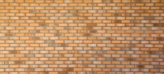 Dark brick wall pattern with chaotic masonry order. Background texture or resource for 3d texturing. Many bricks in big modern stone wall in full frame.