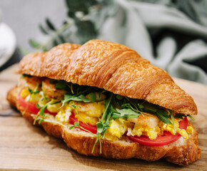 Croissant stuffed scrambled eggs with shrimps