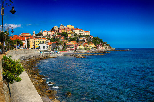 Coastal townscape with traditional colourful buildings, Diano Marina, Imperia, Liguria, Italy